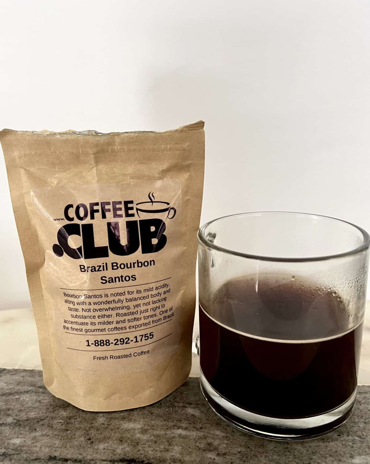 Brazil-Bourbon-Santos-coffee-next-to-a-cup-of-brewed-coffee-scaled