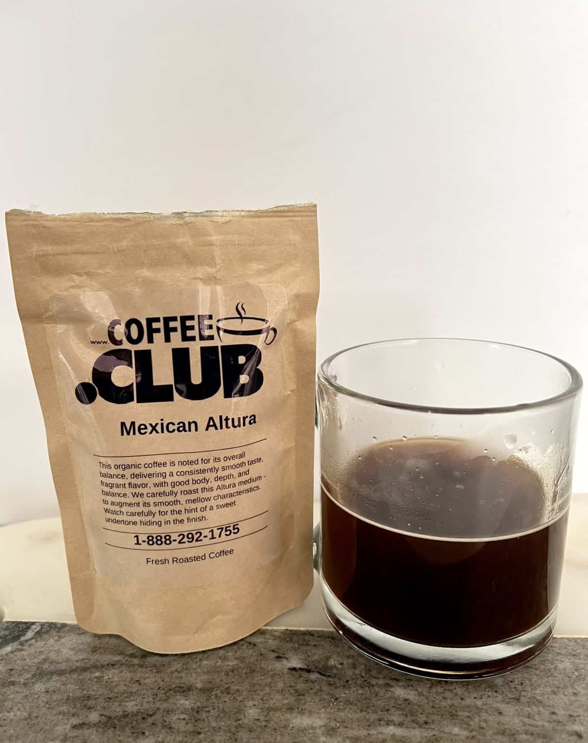 Mexican-Altura-coffee-next-to-a-cup-of-brewed-coffee-scaled